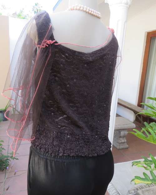 Glamour soot black stetch lace with netting overlay top.One sleeve/one strap.Size 38 by RIMODA.
