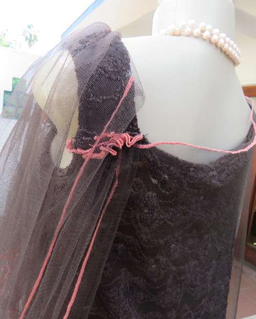 Glamour soot black stetch lace with netting overlay top.One sleeve/one strap.Size 38 by RIMODA.