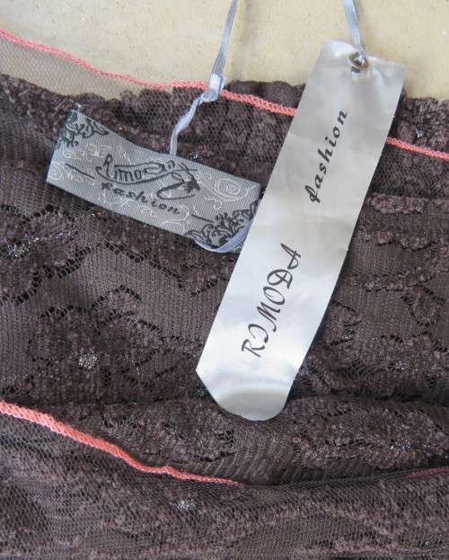 Glamour soot black stetch lace with netting overlay top.One sleeve/one strap.Size 38 by RIMODA.