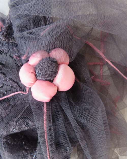 Glamour soot black stetch lace with netting overlay top.One sleeve/one strap.Size 38 by RIMODA.