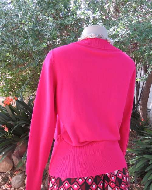 Beautiful, as new, magenta pink pull over knitted V neck top in acrylic/nylon.Size 36/38.WOOLWORTHS