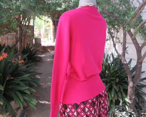 Beautiful, as new, magenta pink pull over knitted V neck top in acrylic/nylon.Size 36/38.WOOLWORTHS