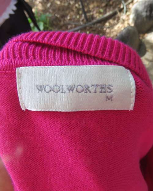 Beautiful, as new, magenta pink pull over knitted V neck top in acrylic/nylon.Size 36/38.WOOLWORTHS