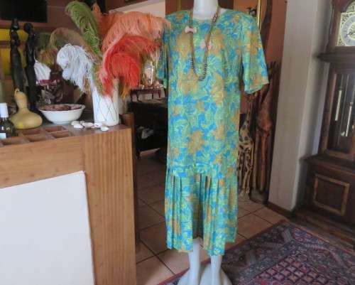 As new vintage dropped waist dress in cool greens and turquoise.Size 44/20 b PRODUCTION STREET.