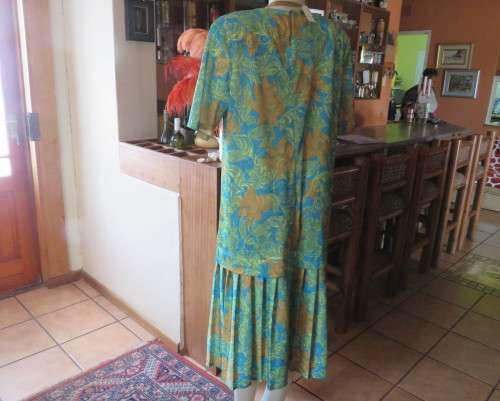 As new vintage dropped waist dress in cool greens and turquoise.Size 44/20 b PRODUCTION STREET.