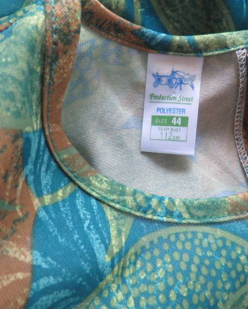 As new vintage dropped waist dress in cool greens and turquoise.Size 44/20 b PRODUCTION STREET.