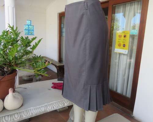 Light weight 2 pc smoke grey skirt suite.Long sleeve 1 button jacket/bandless skirt size 38.As new.