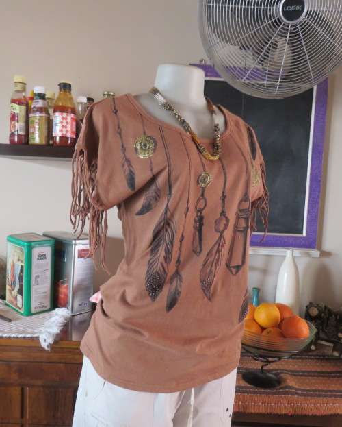 Unique golden brown LEGIT size 34/10 slip over top.Fringed armholes.Front feather/gold patterned.
