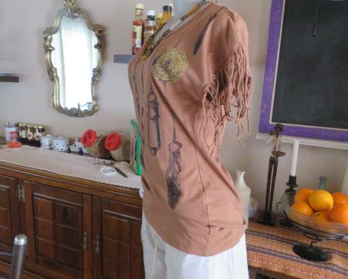 Unique golden brown LEGIT size 34/10 slip over top.Fringed armholes.Front feather/gold patterned.