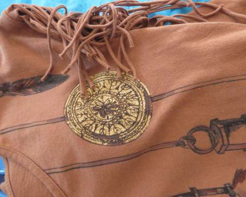 Unique golden brown LEGIT size 34/10 slip over top.Fringed armholes.Front feather/gold patterned.