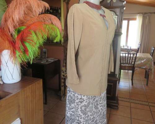 Ultra chic wheat shade slip over long sleeve top in suede look.Brown decor stitching.Size 36 by NEWS
