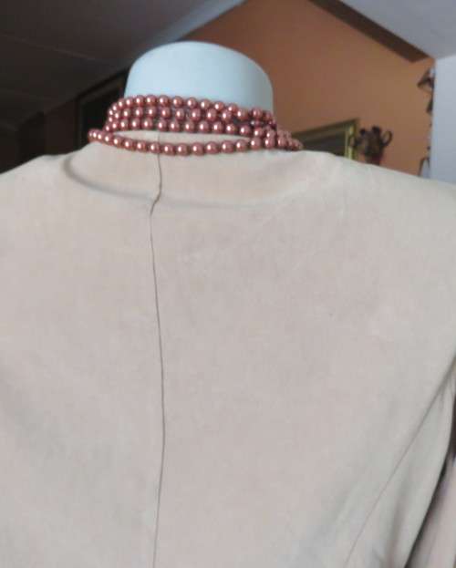Ultra chic wheat shade slip over long sleeve top in suede look.Brown decor stitching.Size 36 by NEWS