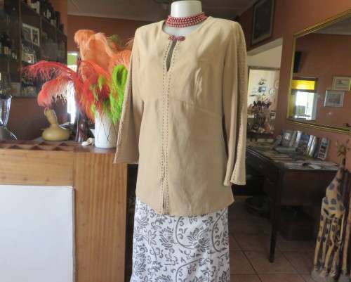 Ultra chic wheat shade slip over long sleeve top in suede look.Brown decor stitching.Size 36 by NEWS