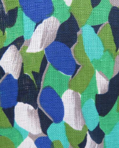 Striking 2 pc skirt suit in blues and greens.Short pencil skirt.Loose button down top.Size 42/18.