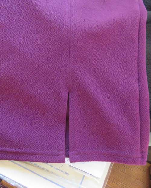 Sexy bodycon violet colour textured stretch polyester skirt.By RT size 34.Left front slit.As new