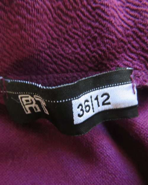 Sexy bodycon violet colour textured stretch polyester skirt.By RT size 34.Left front slit.As new