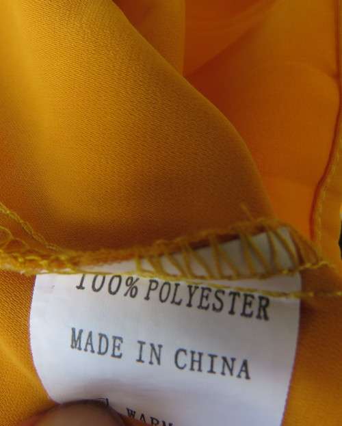 Uniquely styled long mustard top.Silky polyester.Button down.Right side longer.Size 38/40.As new