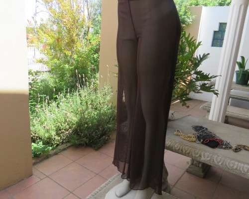 Brown stretch netting wide legg pants to wear under long tops.Size 36 to 38.By PIPPA`S in Vogue.New