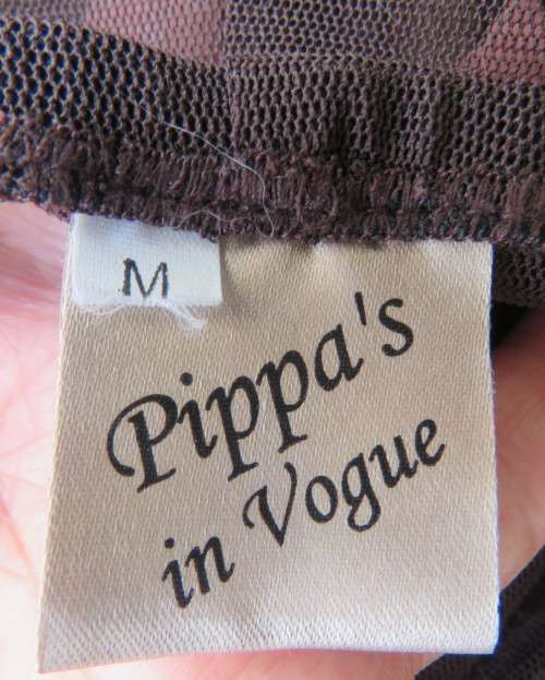 Brown stretch netting wide legg pants to wear under long tops.Size 36 to 38.By PIPPA`S in Vogue.New