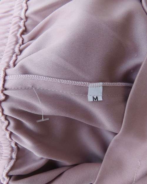 Dusty pink stretch polyester ankle length pants with sheer inlays at bottom. Size 36. Flat front.