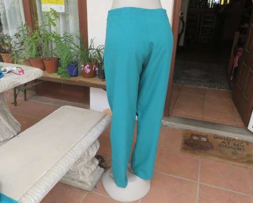 Elegant jade green 2 pc pantsuit by DAYTIMERS size 38/14. Long sleeve lined 3 button jacket.New cond