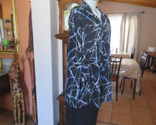 Classic black DONATELLA long sleeve top with grey/blue geometric pattern.Size 46/22.Open collar.