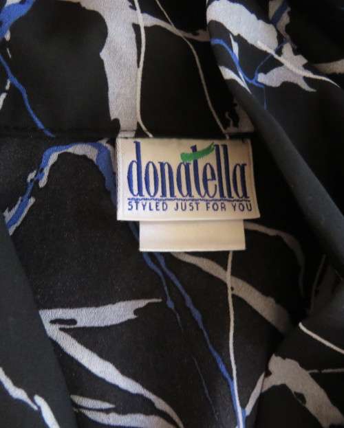 Classic black DONATELLA long sleeve top with grey/blue geometric pattern.Size 46/22.Open collar.