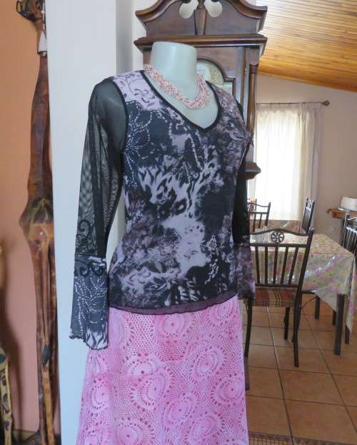 Stunning sheer black long sleeve top. Pale pink flowers on top layer.Size 34 by GOLD.Cord decoration