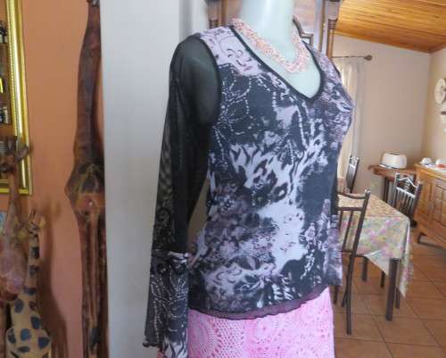 Stunning sheer black long sleeve top. Pale pink flowers on top layer.Size 34 by GOLD.Cord decoration