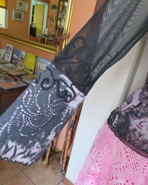 Stunning sheer black long sleeve top. Pale pink flowers on top layer.Size 34 by GOLD.Cord decoration