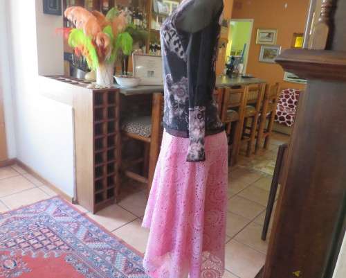 Stunning sheer black long sleeve top. Pale pink flowers on top layer.Size 34 by GOLD.Cord decoration