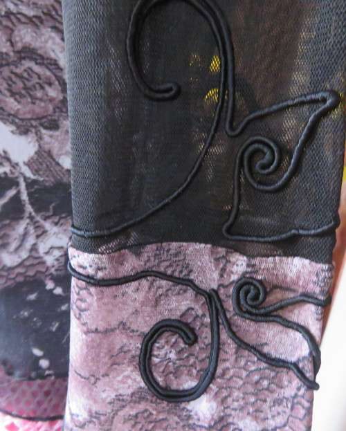 Stunning sheer black long sleeve top. Pale pink flowers on top layer.Size 34 by GOLD.Cord decoration