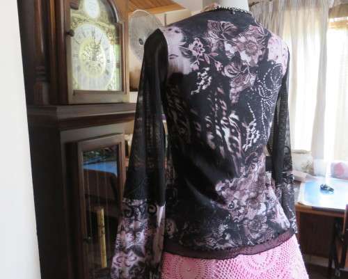 Stunning sheer black long sleeve top. Pale pink flowers on top layer.Size 34 by GOLD.Cord decoration