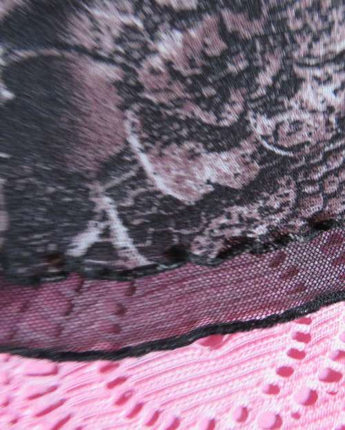 Stunning sheer black long sleeve top. Pale pink flowers on top layer.Size 34 by GOLD.Cord decoration