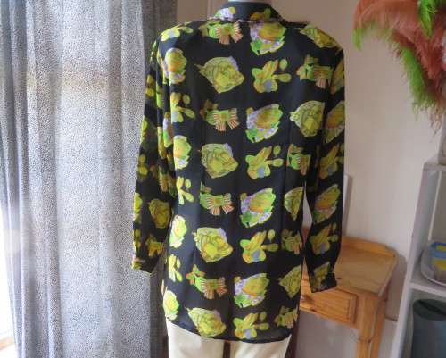 Eyecatching black long sleeve button down blouse with yellow/orange designs.Size 42/18 by B&W.As new