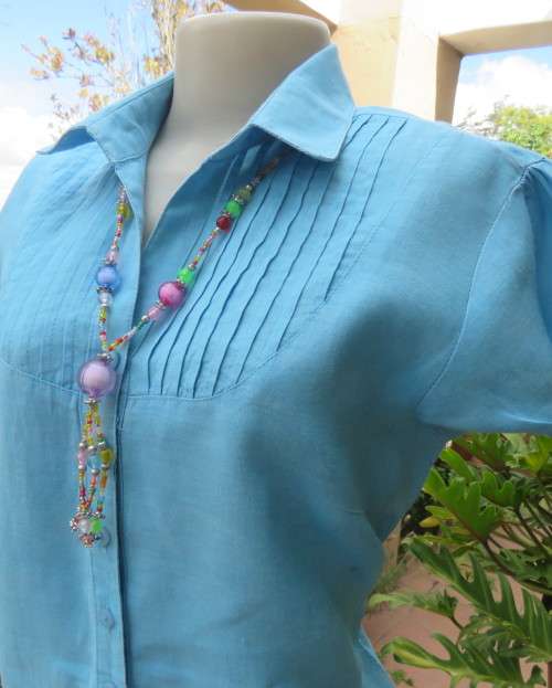 KELSO linen top with button down V front with collar in sky blue size 36/12.Tucked bib on front.