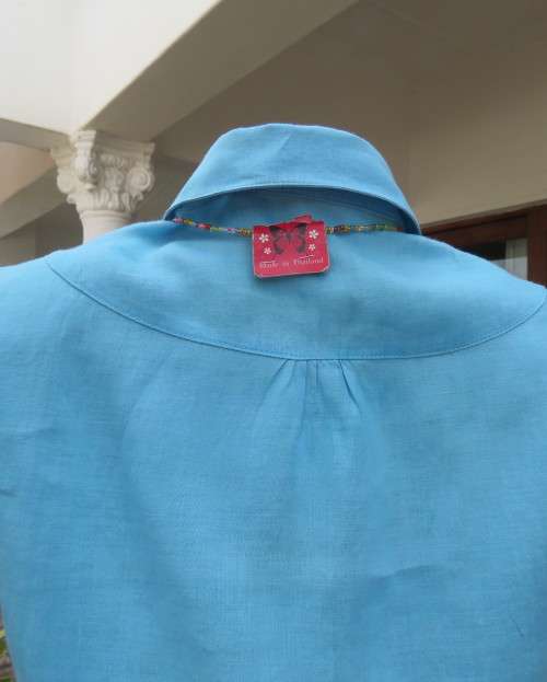 KELSO linen top with button down V front with collar in sky blue size 36/12.Tucked bib on front.