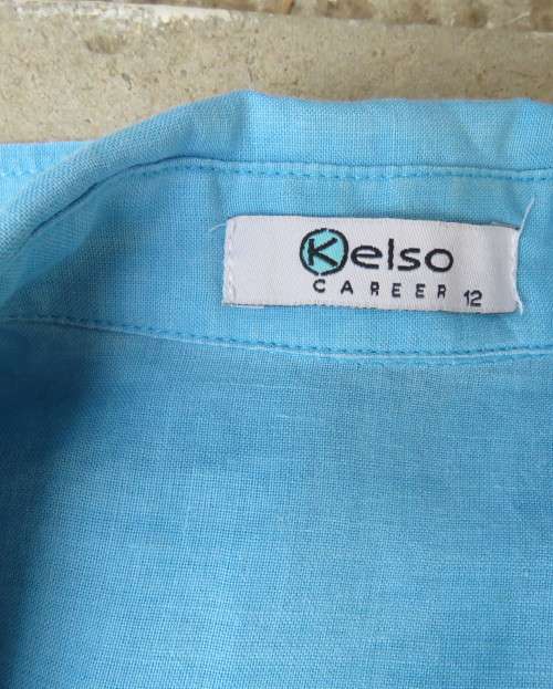 KELSO linen top with button down V front with collar in sky blue size 36/12.Tucked bib on front.