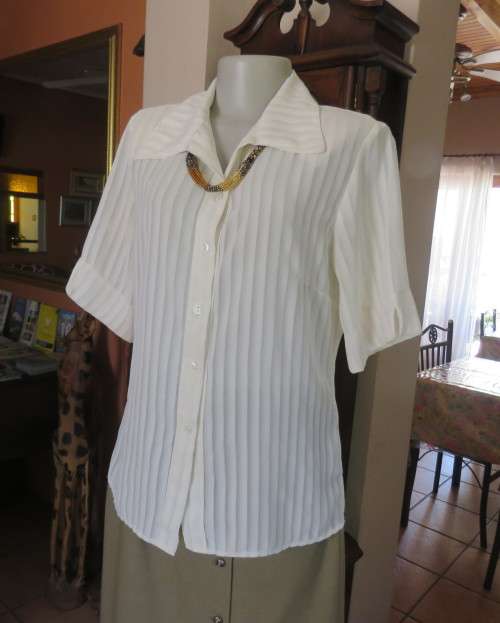 Classic sheer vertical striped polyester short sleeve top.Button down.Open collar.Size 36.Good cond