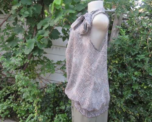 Chic brown/white animal print sleeveless slip over polyester top. Wide banded collar to tie. Size 38