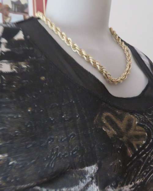 Stunning top by PERUZZI from Ireland. In black netting.2 layers.Top layer printed.Size 36/12.As new
