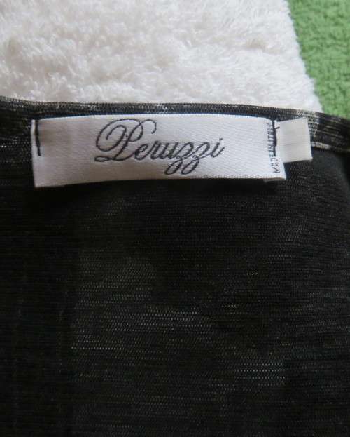 Stunning top by PERUZZI from Ireland. In black netting.2 layers.Top layer printed.Size 36/12.As new
