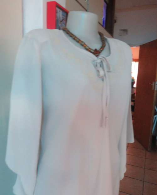 Beautiful wheat polyester slip over top Long angel sleeves.Scooped neckline with tiestring.Size 44