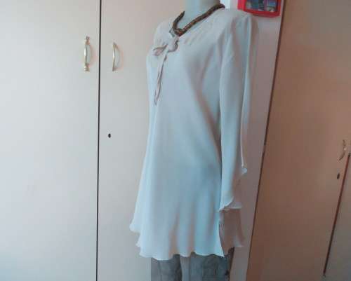 Beautiful wheat polyester slip over top Long angel sleeves.Scooped neckline with tiestring.Size 44