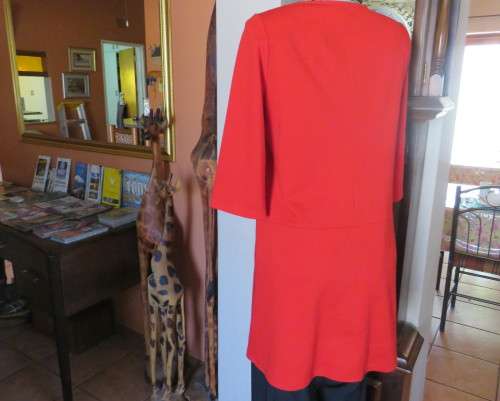 Smart cherry red long top in poly/rayon stretch jersey.By WOOLWORTHS size 38/14.New condition.