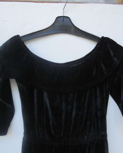 Black glamour stretch poly velvet jumpsuit calf length.Size 30/6.Scooped frilled neckline.As new.