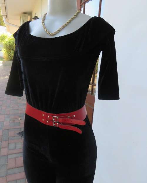 Black glamour stretch poly velvet jumpsuit calf length.Size 30/6.Scooped frilled neckline.As new.