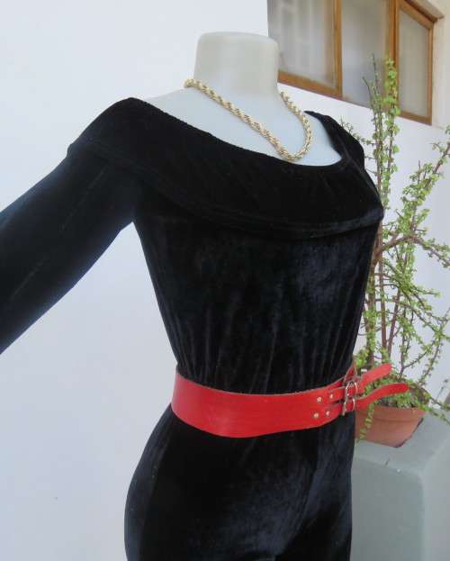 Black glamour stretch poly velvet jumpsuit calf length.Size 30/6.Scooped frilled neckline.As new.