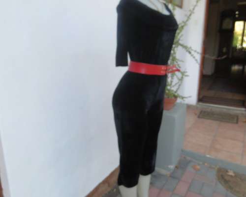 Black glamour stretch poly velvet jumpsuit calf length.Size 30/6.Scooped frilled neckline.As new.