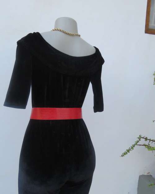 Black glamour stretch poly velvet jumpsuit calf length.Size 30/6.Scooped frilled neckline.As new.